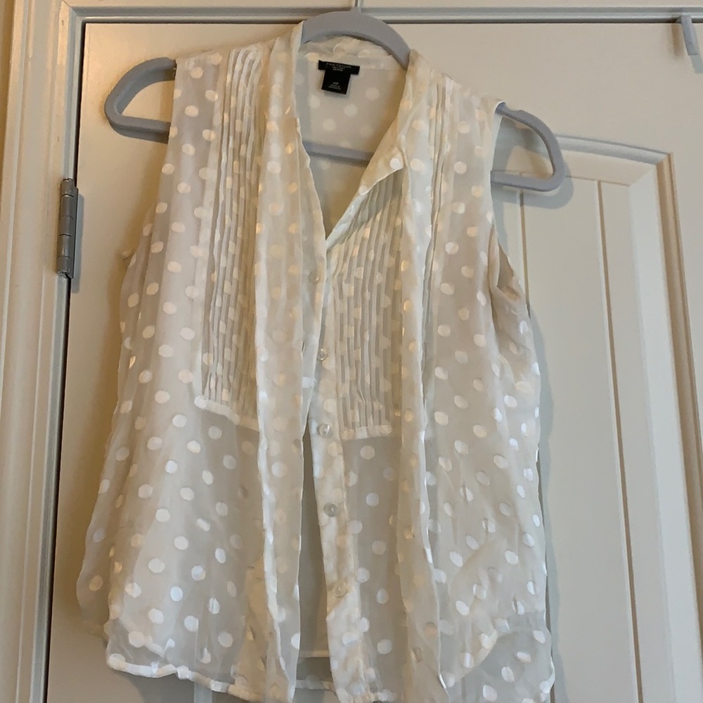 Ann Taylor White sleeveless dress shirt.
